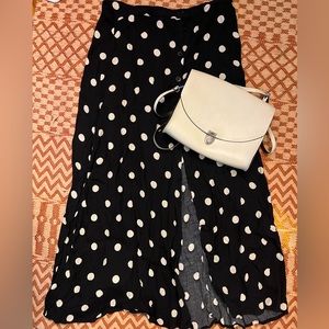 Reformation skirt and Cambridge Satchel Company leather purse.